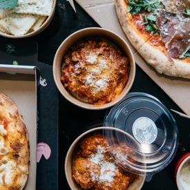 Wood-fired pizza and Nonna's meatballs in Grumpy Italian Leichhardt takeaway boxes